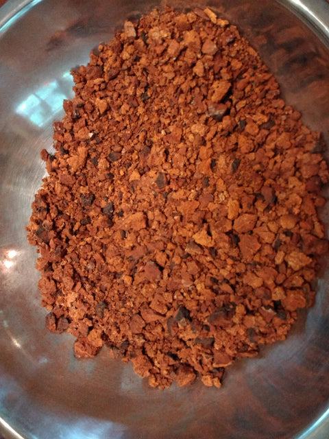 a bowl of chaga granuals